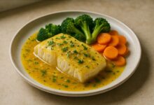 Baked cod with saffron lemon sauce — finished dish